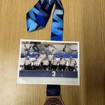 A team photograph and medal displayed at the club